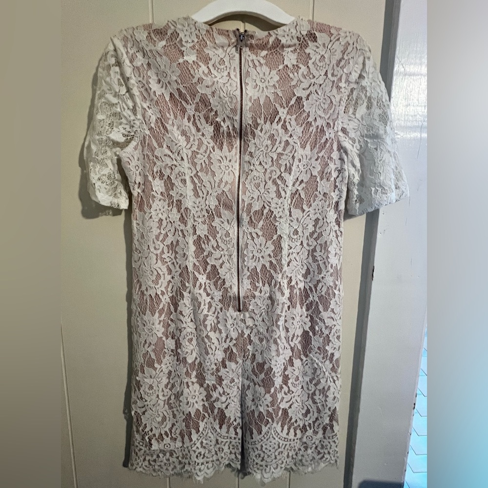 Pink dress with white lace overlay and lace up front